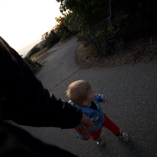 Toddler's First Steps on Mountain Trail at Dusk
