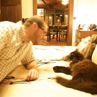Man Relaxing in Cozy Living Room with Feline Friends
