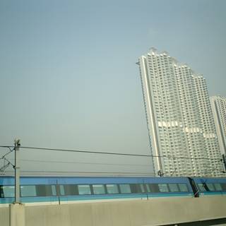 Train Traveling Through Urban High Rises