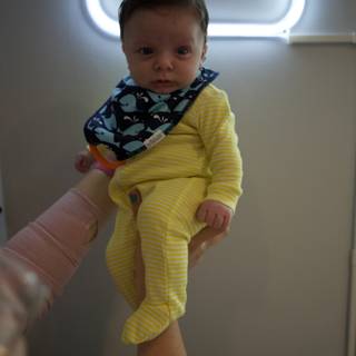 A Joyful Lift: Baby Wesley at 2 Months
