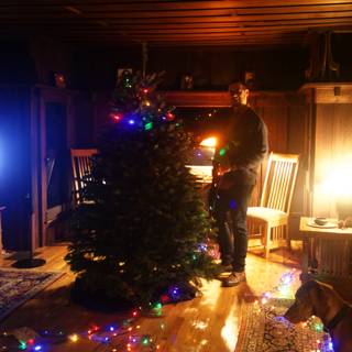 Festive Man Standing By Lighting Christmas Tree