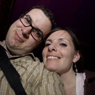 Smiling Couple Close-Up at Nighttime Event