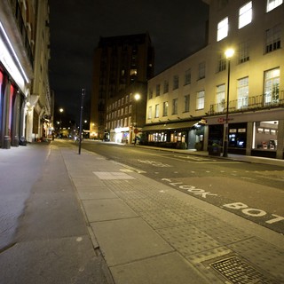 Quiet London Street at Night with Illuminated Buildings
