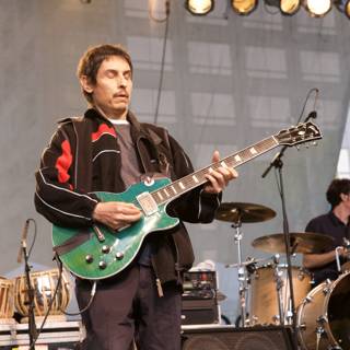 The Ultimate Music Performance: Man playing a Guitar on Stage