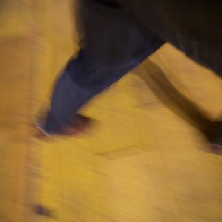 Blurred Steps on a Yellow Hardwood Floor
