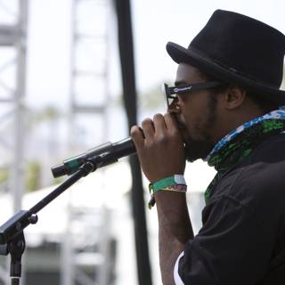 Hat-wearing Singer Croons into Microphone at Coachella 2008
