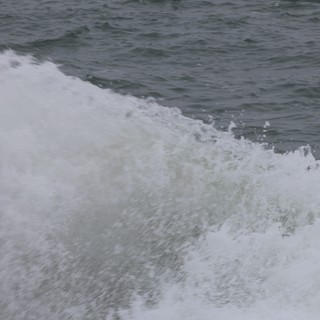 Churning Ocean Wake Crashes in Dramatic Foam