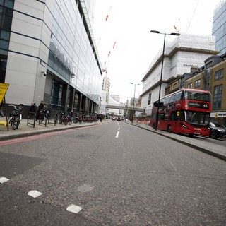 Red Double-Decker Bus on Modern London Street
