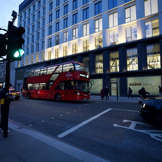 London Double-Decker Bus at Twilight Intersection