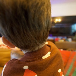 Toddler in Festive Christmas Sweater from Behind