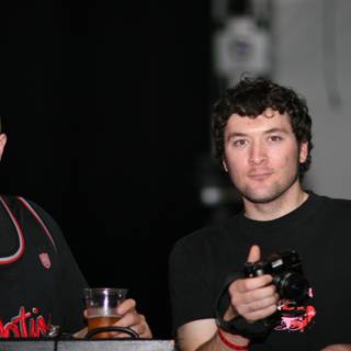 Two Men Enjoying Beers Together