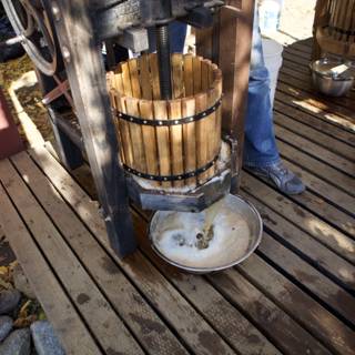 Pouring Liquid into a Wooden Bucket