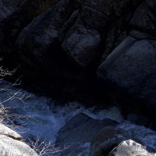 Winter Rapids Through Granite Canyon Shadows