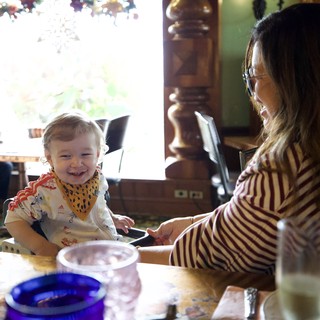 Mother and Toddler Sharing a Joyful Meal Together