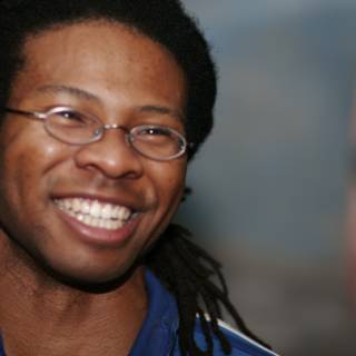 Happy Man with Dreadlocks and Glasses