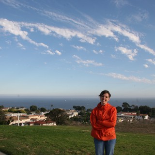 Woman in Red Jacket Overlooking Coastal California Town