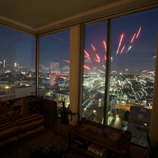 Fireworks Illuminate the City from a Living Room Window