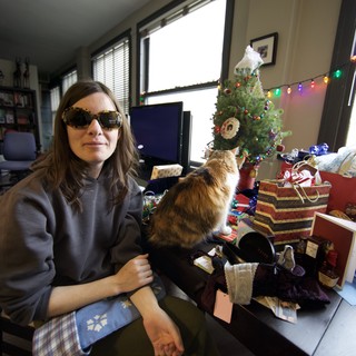Penelope and Cat Amid Christmas Gifts and Cheer