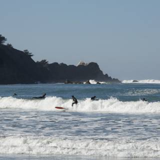 Pacifica Surfers Take On The Waves - A Group Affair