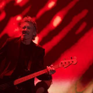 The Bass Player in Red Light