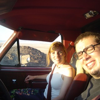 Two Friends Road Tripping Through Desert Landscape