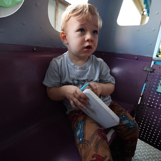 Toddler with Milk Box at Indoor Play Area
