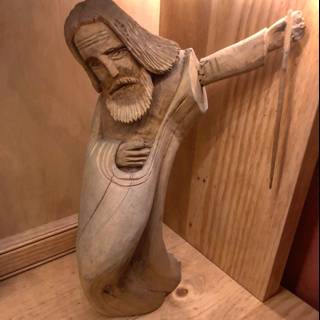 Wooden Statue of a Knife-Wielding Man