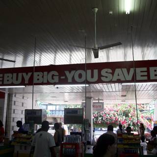 We Buy Big You Save Big Sign