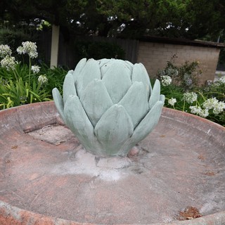 Artichoke Fountain Sculpture in Serene Garden Setting