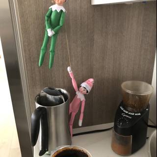 Two Elf Dolls Enjoying their Coffee