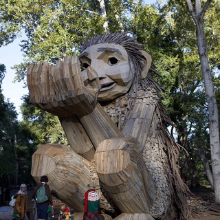 Public park or sculpture garden, possibly in Pacific Northwest or similar wooded region