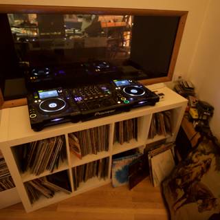 DJ Mixer and CD Player on Wooden Shelf
