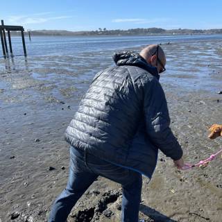A Man and His Canine Companion Explore the Bodega Bay Beach