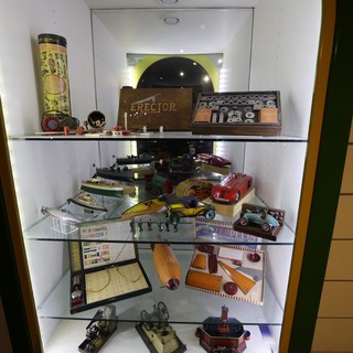 Vintage Toy Collection Display in Illuminated Cabinet