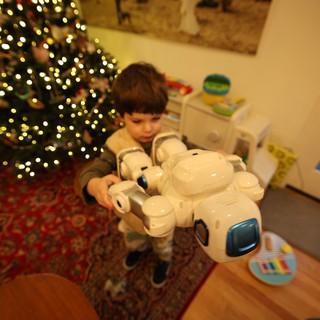 Child Playing with Robot Toy on Christmas Morning