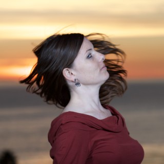Woman in Red at Golden Hour Sunset Shore