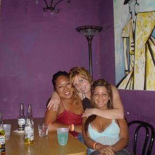 Three Friends Enjoying a Night Out at the Bar