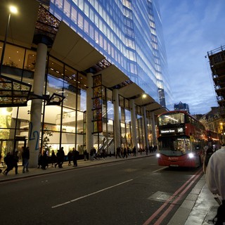 Modern London Architecture at Twilight with Red Bus