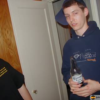 Blue Hoodie and a Bottle of Beer