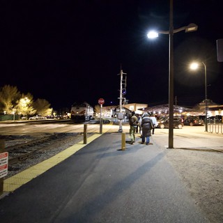 Night Arrival at Illuminated Train Station Platform