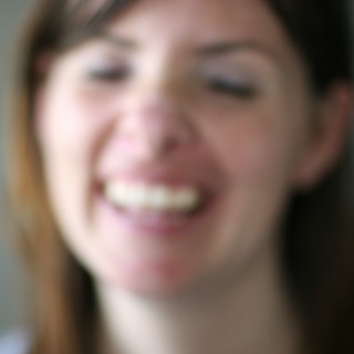 Joyful Close-Up Portrait of Smiling Young Woman