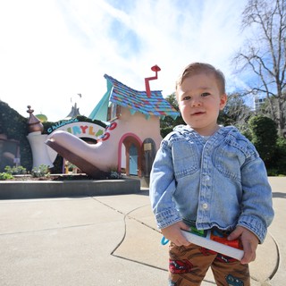 Toddler at Toontown Amusement Park on Sunny Day