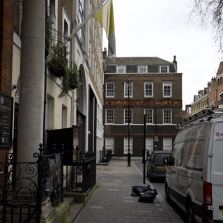 Narrow London Alley Leading to Historic House of Charity