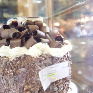 Decadent Chocolate Cake Display in Bakery Window