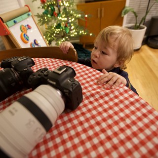 Toddler's Curious Christmas Morning with Camera Equipment