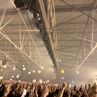 Skrillex and Four Tet Concert Crowd in Industrial Venue