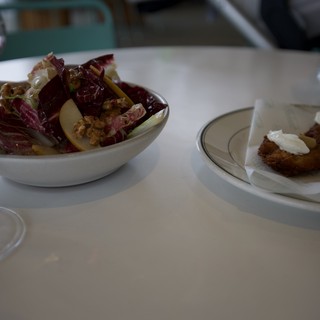 Elegant Restaurant Dining with Radicchio Salad and Breaded Cutlet