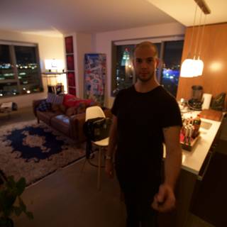 Man Standing in a Stylish Living Room with City View