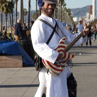 Turbaned Musician Playing Electric Guitar Outdoors