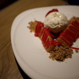 Artisan Dessert Plating with Ice Cream and Raspberry Coulis